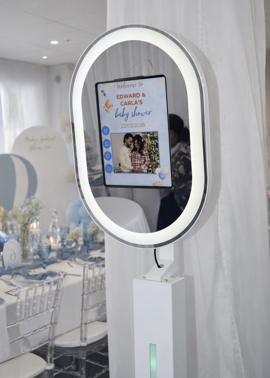 Illuminated mirror photobooth at a baby shower celebration